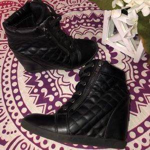 Black wedge ankle boots.